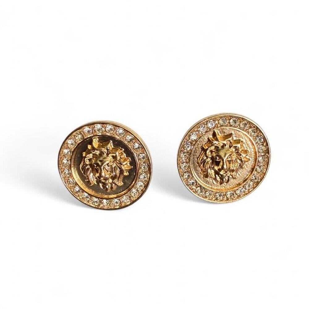 Gold medusa head earrings with
